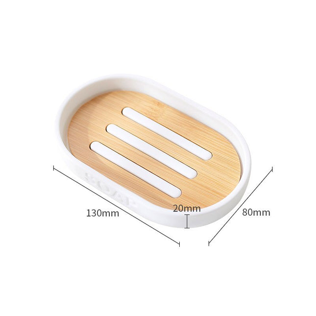 Valkoinen soikea saippua-alusta puuritilällä