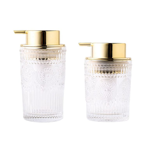 Lasinen saippua-annostelija kultaisella pumpulla