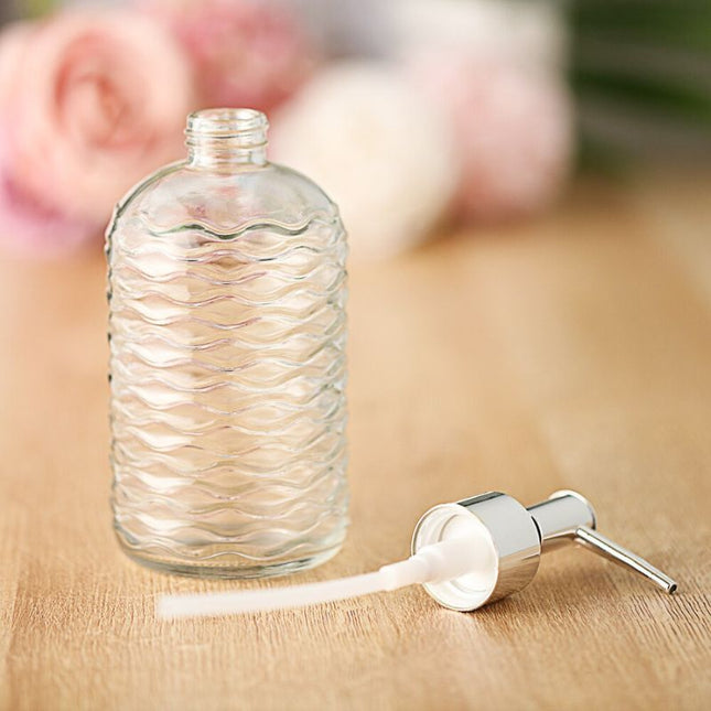 Lasinen saippua-annostelija aaltokuviolla