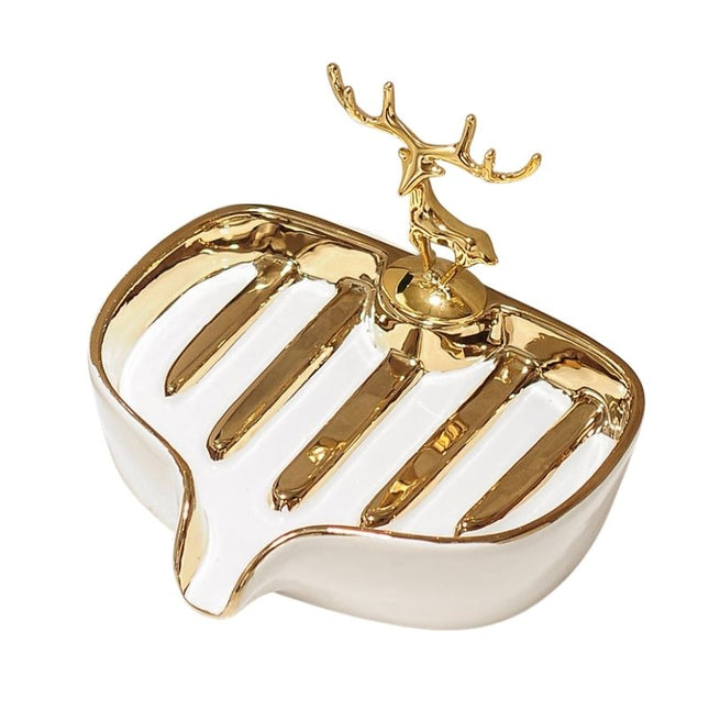 Keraaminen saippua-alusta kultaisella peuralla