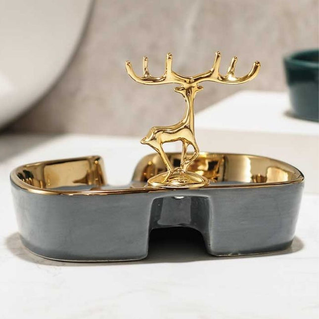 Keraaminen saippua-alusta kultaisella peuralla