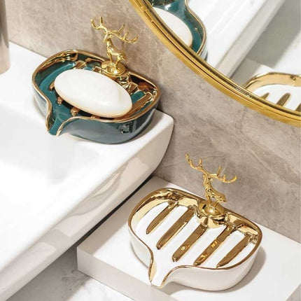 Keraaminen saippua-alusta kultaisella peuralla