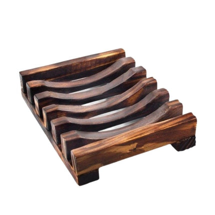 Tumma puinen saippua-alusta ritilällä