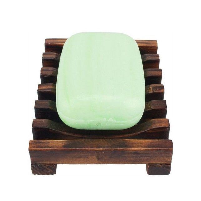 Tumma puinen saippua-alusta ritilällä