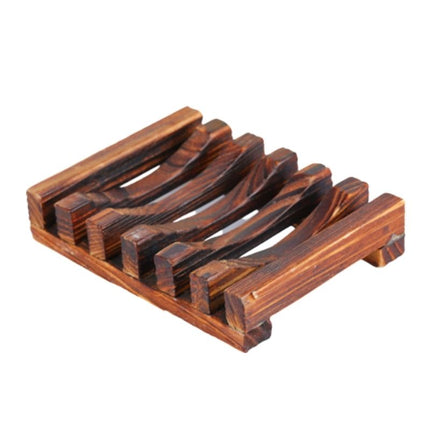 Tumma puinen saippua-alusta ritilällä