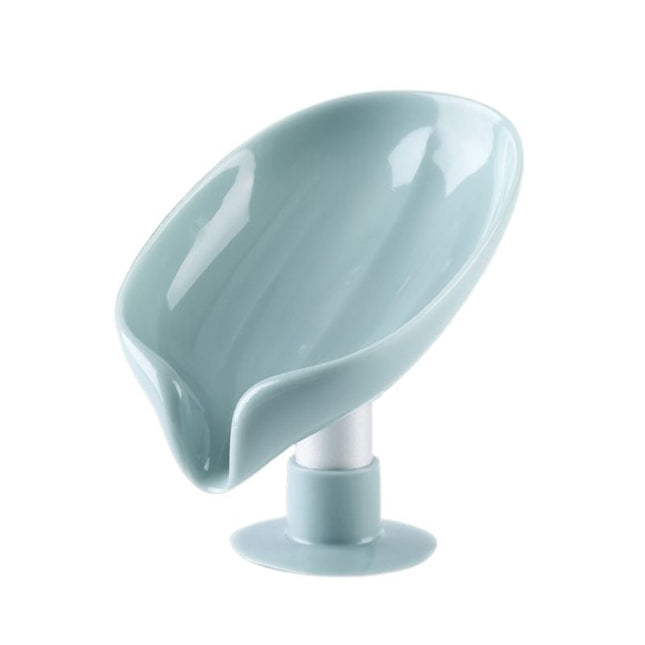 Lehden muotoinen itsetyhjentyvä saippua-alusta