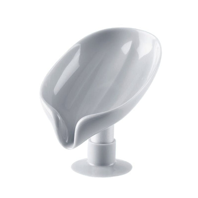 Lehden muotoinen itsetyhjentyvä saippua-alusta