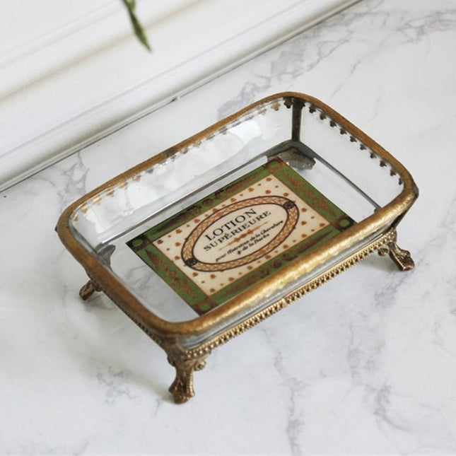 Lasinen saippua-alusta messinkikehyksellä